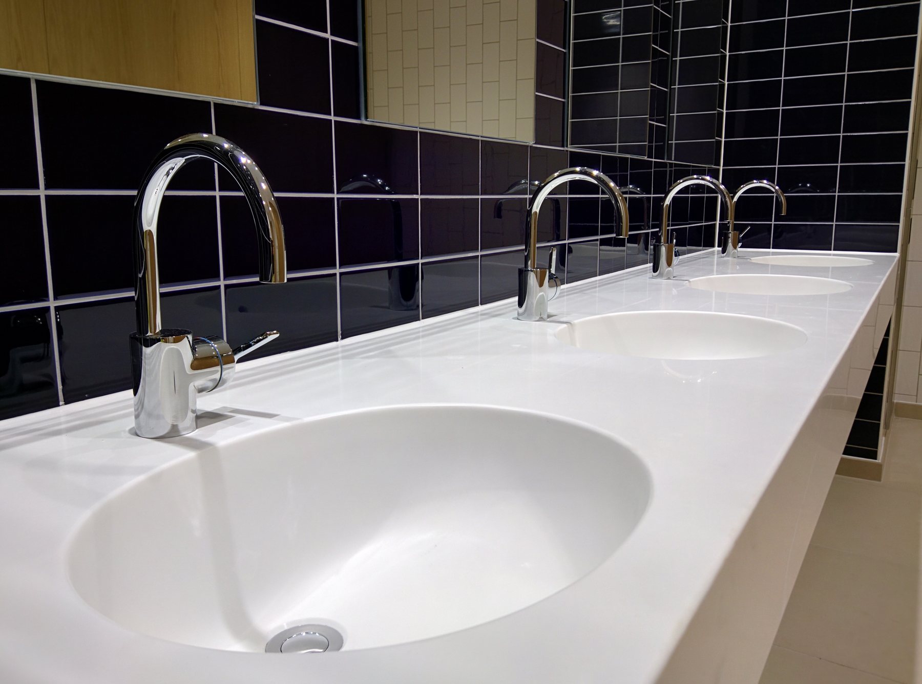 A solid surface vanity top with an inset countertop basin