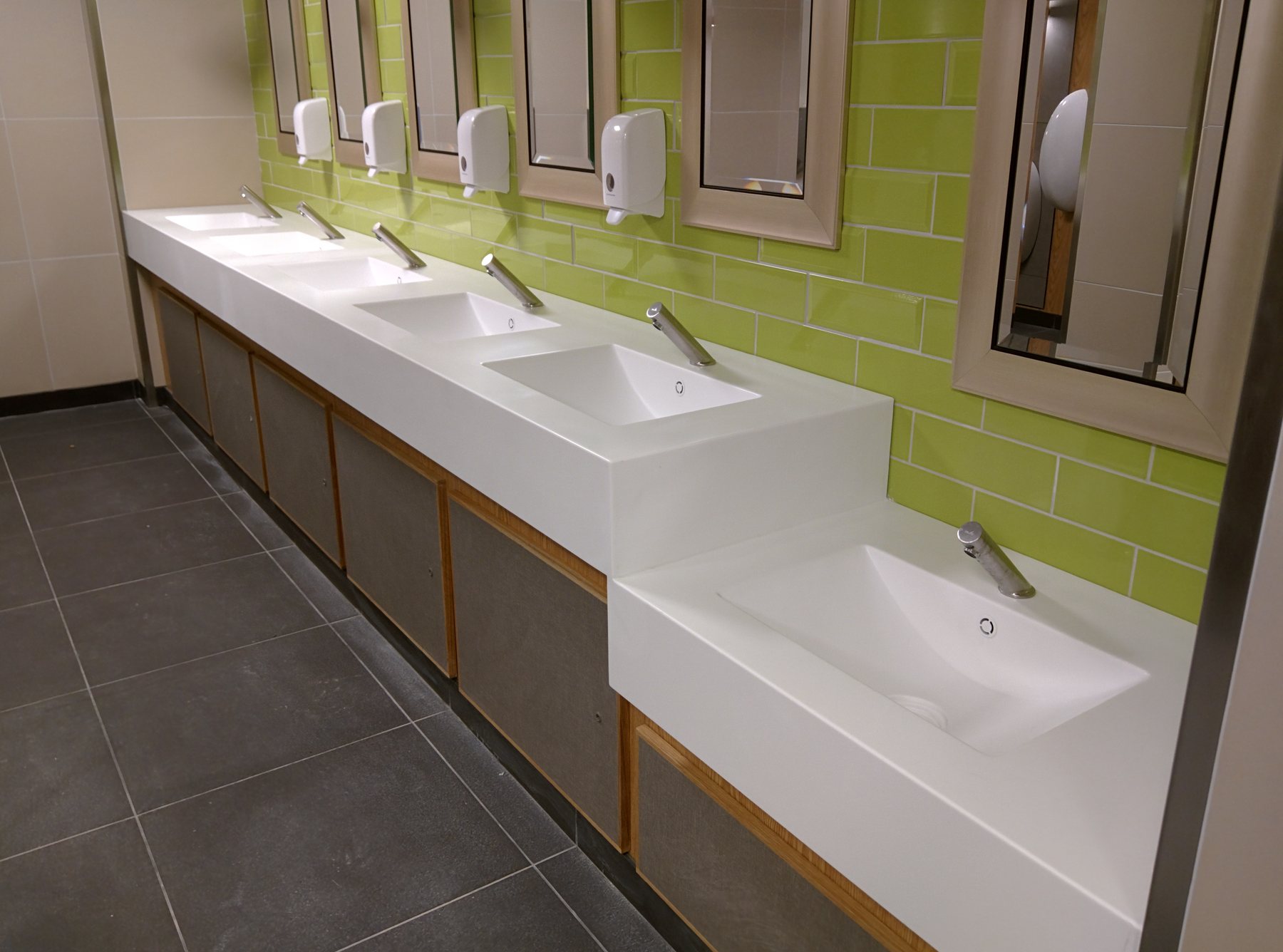 A solid surface vanity top with integrated basins